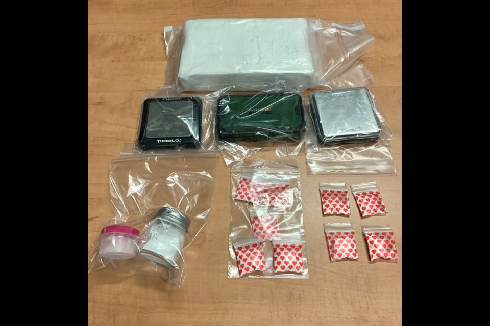 Police seized various items including drugs and cash after a four-month investigation in the Kenora area (OPP photo)