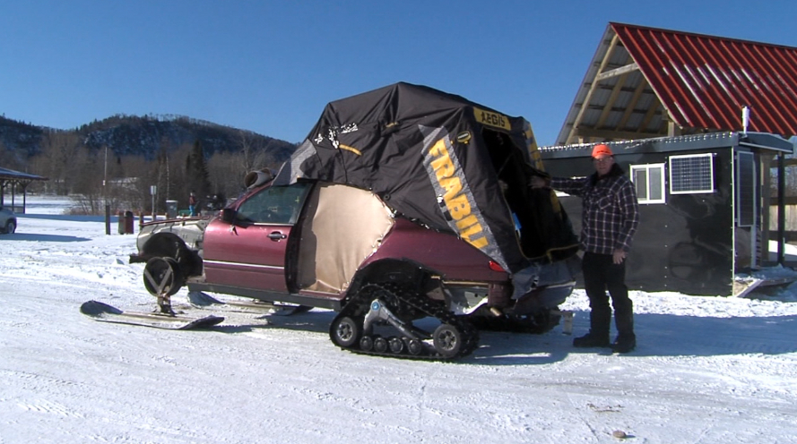 Donald Stenlund of Red Rock poses with his custom-built Wolf Track ice fishing vehicle (Mitchell Ringos/TBTV photos)