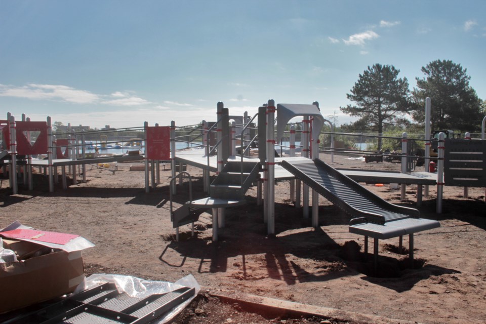 The grand opening of the playground, adult fitness center, and beach volleyball area is set for September