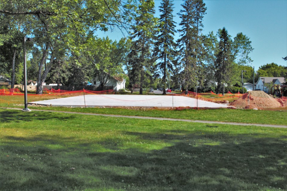 Work is underway at Dease Park to build a skating rink that will serve as a basketball court in the warmer months.