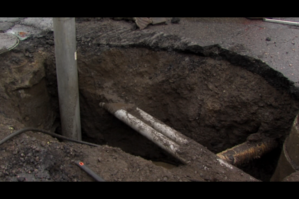 Repairs to a broken pipe and a section of road were completed Tuesday where a sinkhole developed at Oliver Road and High Street (Vasilios Bellos/TBTV photos)