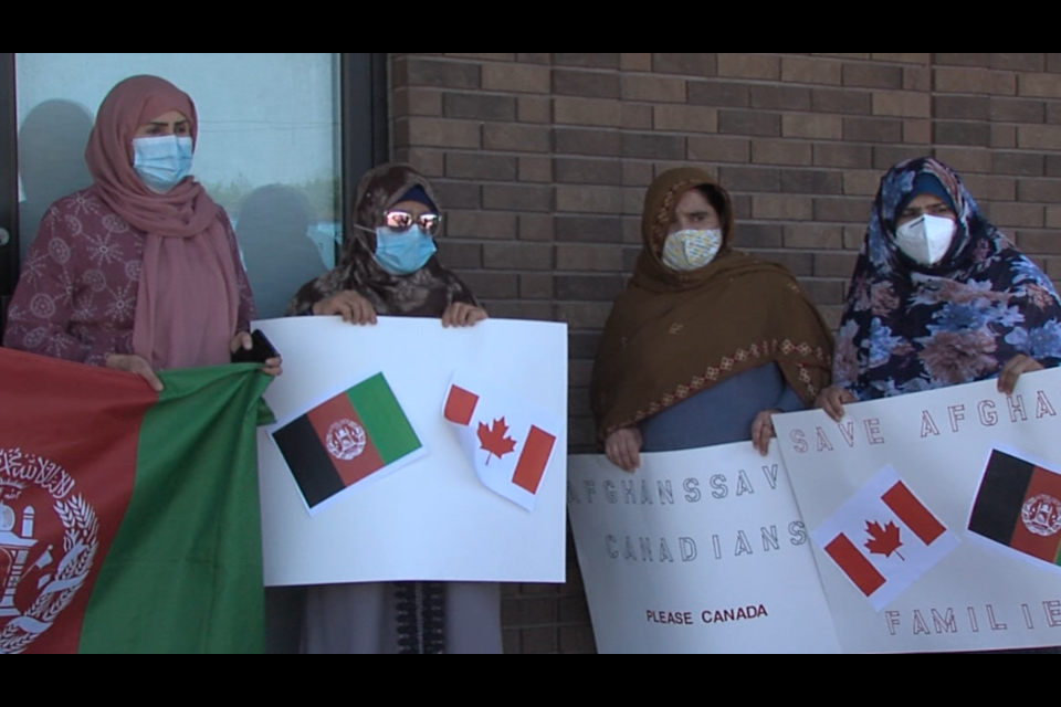 About 10 people gathered outside the office of Thunder Bay-Superior North MP Patty Hajdu on June 20 to advocate for Afghan refugees (Vasilios Bellos/TBTV photo)