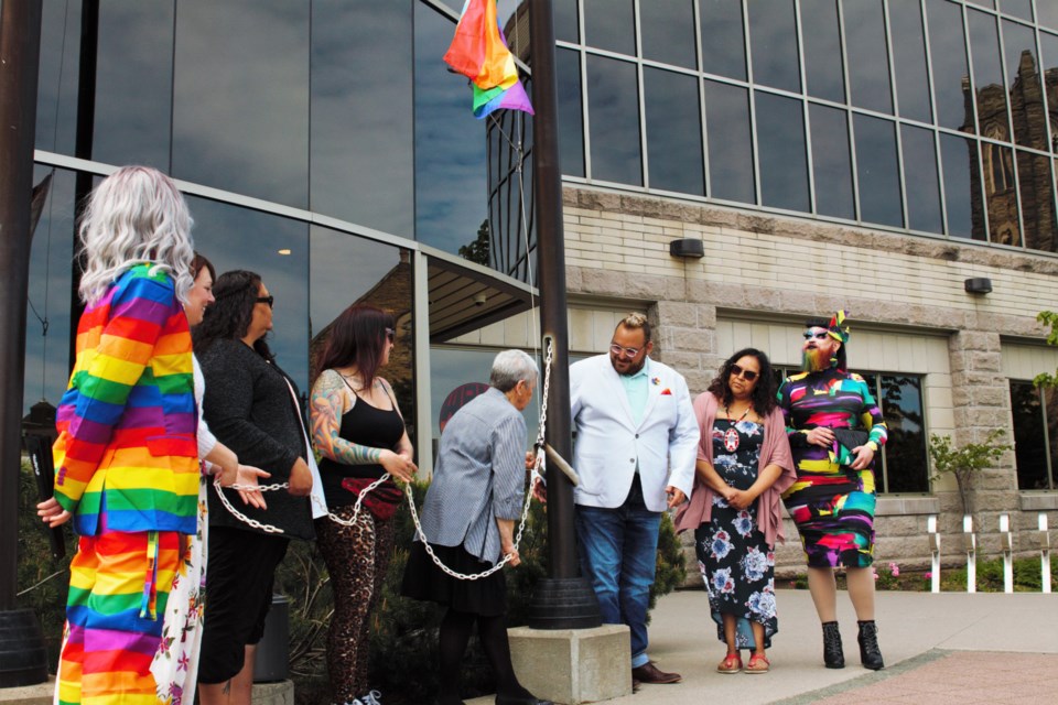 Acting mayor Rebecca Johnson, centre, helped raise a pride flag at Thunder Bay's city hall on Friday. (Ian Kaufman, TBnewswatch)