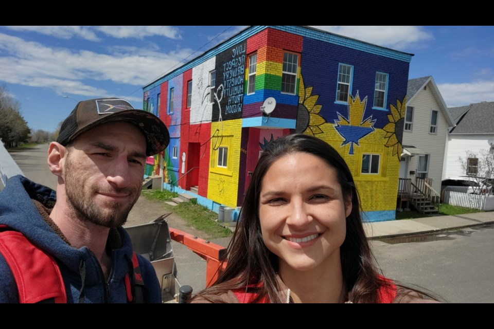 Derek Thomson (AbraxaN) and Candace Deschamps (CJD) were commissioned to paint the mural by building owners Kyle and Tracey Vescio (Facebook/AbraxaN Canada)