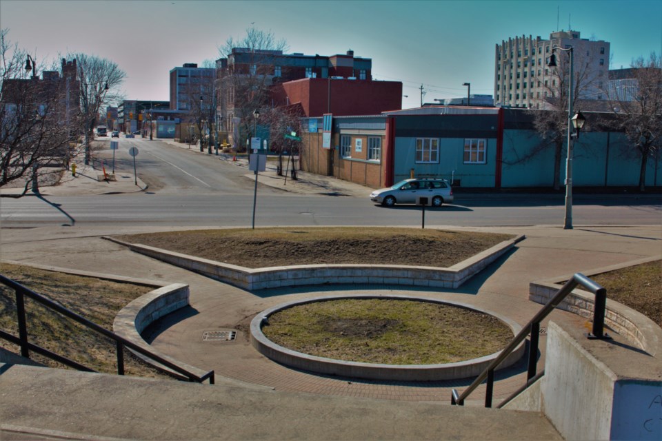 The space proposed for the Gone Too Soon memorial garden features a circular bed that is not currently planted.