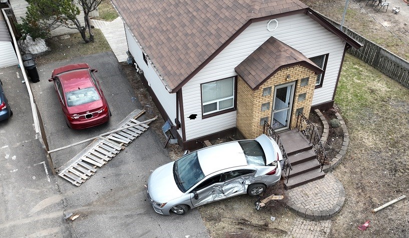 A drone image shows the aftermath after a man struck a pedestrian and multiple vehicles and homes with his truck on Tuesday. (Thunder Bay Police Service)