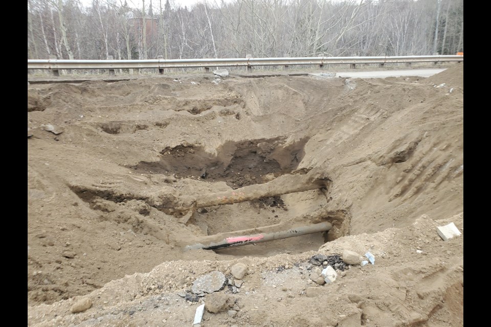 The cause of a sinkhole on River St. is linked to the apparent failure of a plate at the bottom of a culvert McVicar Creek flows through (TBnewswatch photos)