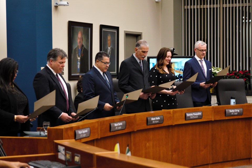 City councillors Rajni Agarwal, Mark Bentz, Albert Aiello, Dominic Pasqualino, Shelby Ch'ng, and Michael Zussino recite an oath of office during their inauguration on Monday, Nov. 28, 2022. (Ian Kaufman, TBnewswatch)