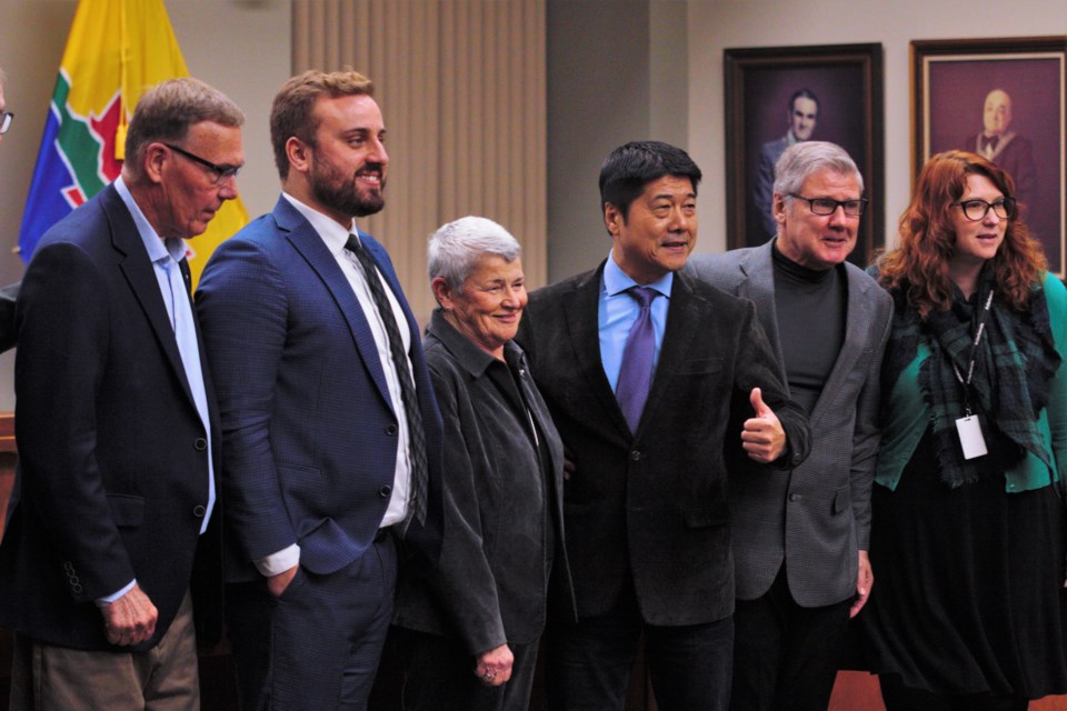 Departing city councillors (from left) Brian McKinnon, Cody Fraser, Rebecca Johnson, Peng You, and Aldo Ruberto, accompanied by city clerk Krista Power, were honoured in a brief ceremony at city hall Monday. (Ian Kaufman, TBnewswatch)
