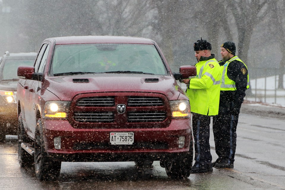 OPP officers conduct a Festive RIDE check in Thunder Bay on Tuesday, Nov. 29, 2022. (Leith Dunick, tbnewswatch.com)