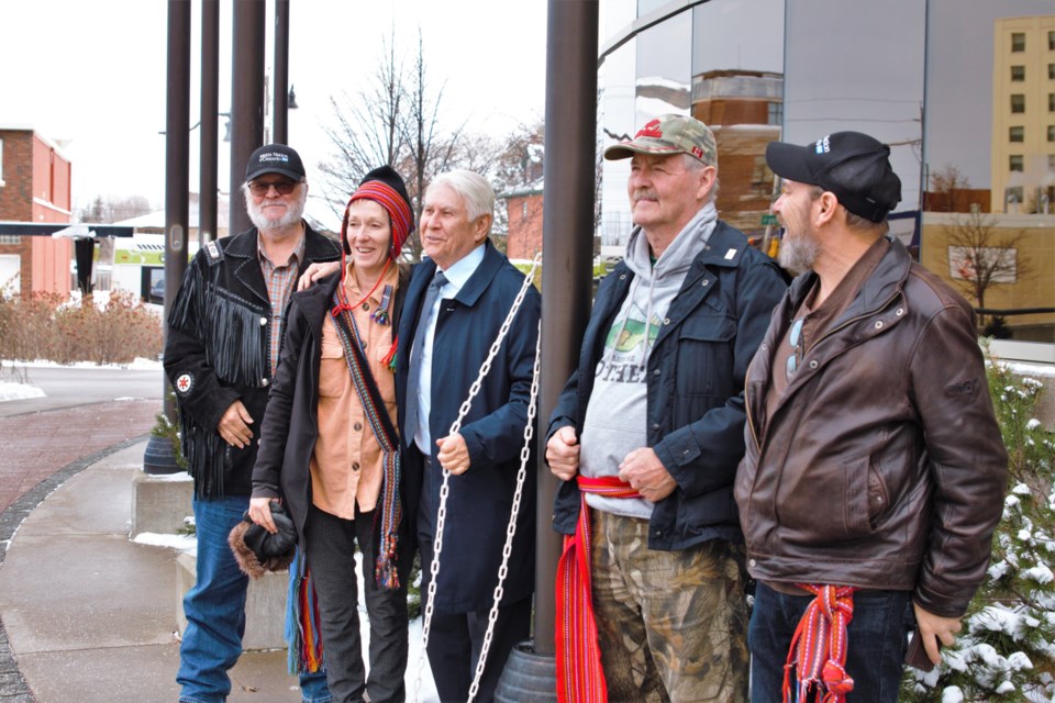 Mayor Ken Boshcoff (centre) joined members of the region's Métis community for a flag-raising at city hall on Wednesday. (Ian Kaufman, TBnewswatch)