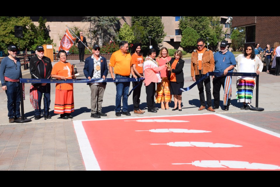                    Lakehead University unveiled its new Every Child Matters crosswalk and raised a National Truth and Reconciliation flag on Wednesday, Sept. 7, 2022.                 