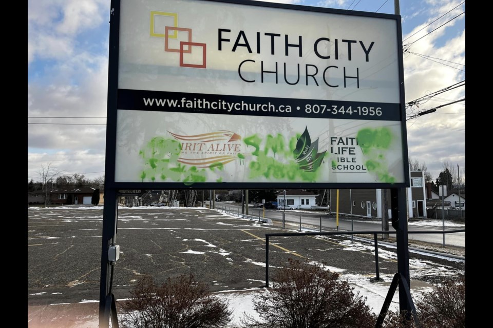 Vandals painted obscenities (blurred for publication) on both sides of the sign outside Faith City Church on Black Bay Road in Thunder Bay (Steve Hussey photo)