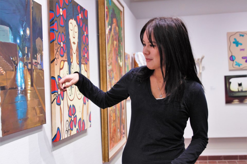 DFC student Tessa Harper's painting 'Solace,' at left, is featured in a new exhibit at the Thunder Bay Art Gallery. (Photos by Ian Kaufman, TBnewswatch)