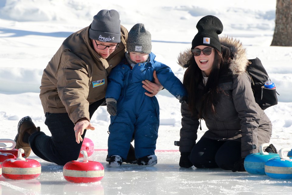 Outdoor curling was a popular attraction at the Voyageur Winter Carnival on Saturday, Feb. 18, 2023 at Fort William Historical Park. (Leith Dunick, tbnewswatch.com)