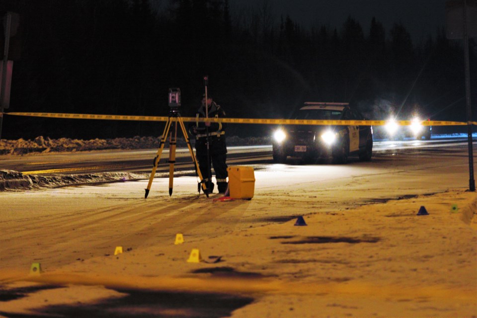 Investigators process the scene of a collision at the intersection of highway 11/17 and Red River Road on Tuesday night. (Ian Kaufman, TBnewswatch)