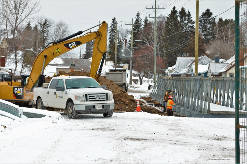 Crews excavate a section of River Street where a culvert collapsed in May of 2022. (Photos by Ian Kaufman, TBnewswatch)
