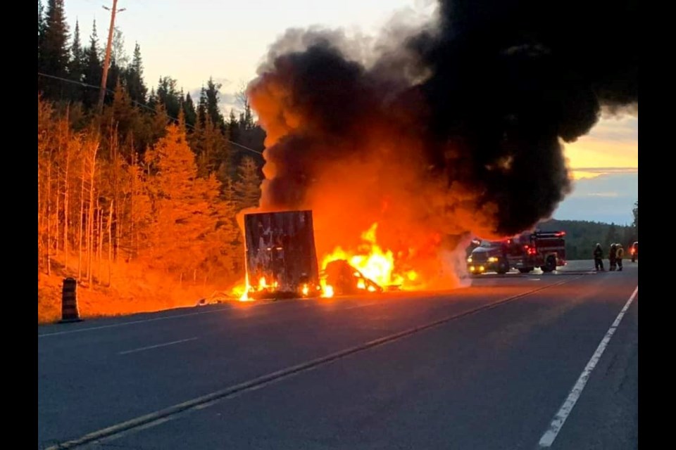 A trailer was engulfed in flames on Highway 11 near Orient Bay on July 10, 2023 (Skilled Truckers Canada/Facebook/Leon Furoy)
