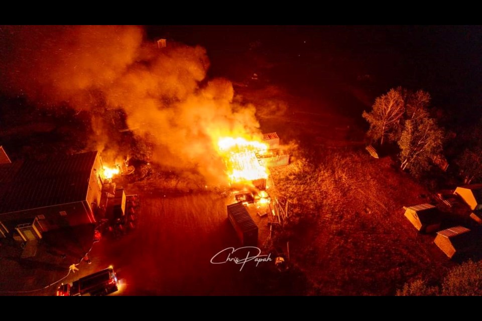 A fire started in an abandoned vehicle and storage containers spread to the water treatment plant at Eabaemetoong First Nation on July 5, 2023 ( Chris Papah photo)