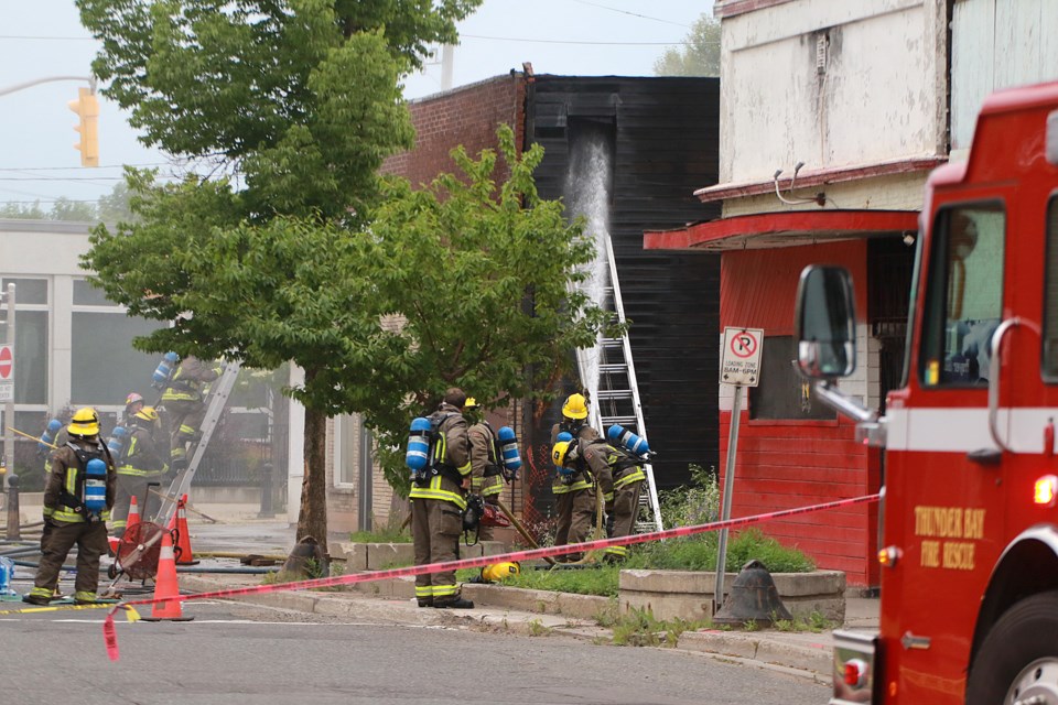 Thunder Bay Fire Rescue crews douse the former European Bakery on Simpson Street after a fire broke out in the building on Sunday, July 9, 2023. (Leith Dunick, tbnewswatch.com)