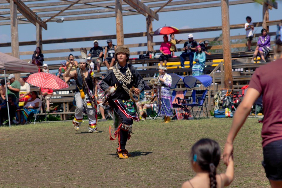Keenan Sanden (center) won the Woodland Dance Special 