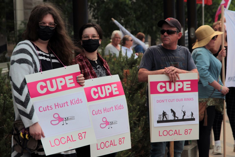 People gathered outside Thunder Bay city hall on Monday, June 26, 2023 to protest potential city budget cuts in advance of a council meeting that evening. (Matt Vis, TBnewswatch.com)