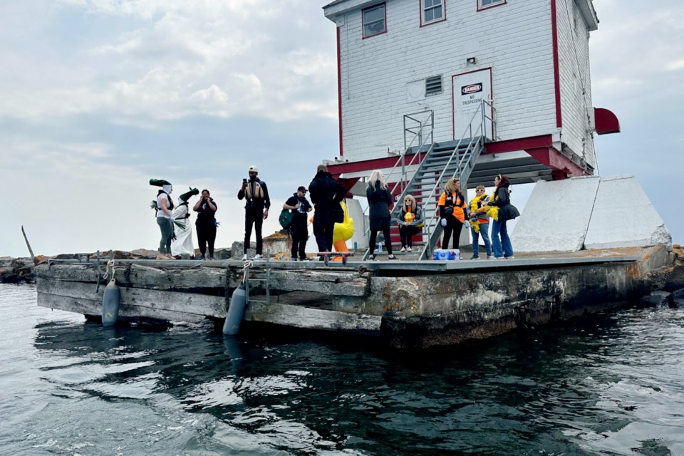 Castaways were loaded onto boats and taken out to the lighthouse to await rescue