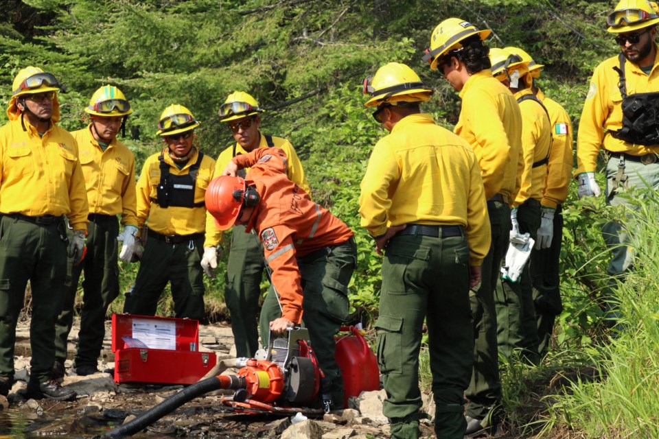 Mexican firefighters received instructions on the operation of Ontario's firefighting equipment including the Mark 3 water pump (Alison Bezubiak/MNRF photo)