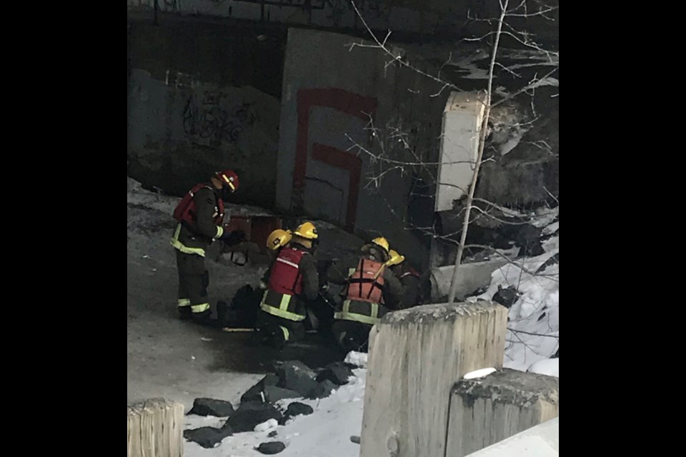 Thunder Bay firefighters attended to an injured man on McVicar Creek at the Algoma Street bridge on March 12, 2023 (Submitted photo)