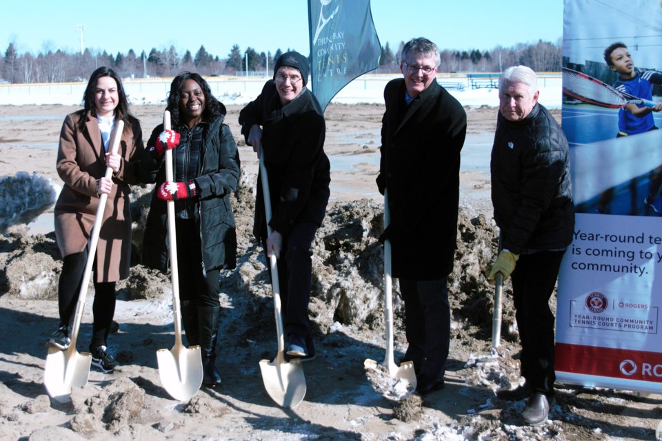 Tennis Canada's Eva Havaris, Ontario Tennis Association board chair Dianne Weatherby, Thunder Bay Community Tennis Centre president Jason Everett, Thunder Bay-Atikokan MPP Kevin Holland, and Thunder Bay Mayor Ken Boshcoff participated in the ceremonial groundbreaking for the indoor tennis project on Monday, March 13, 2023. (Matt Vis, TBnewswatch.com)