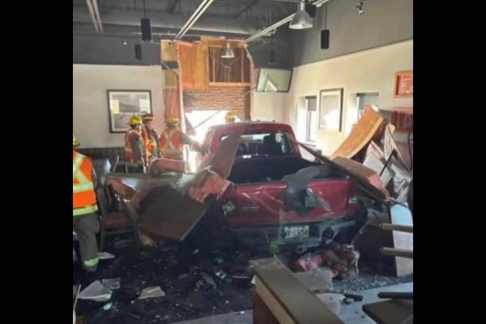 No one was injured when a vehicle crashed through the wall of Boston Pizza on Arthur Street on May 14, 2023 (Facebook)