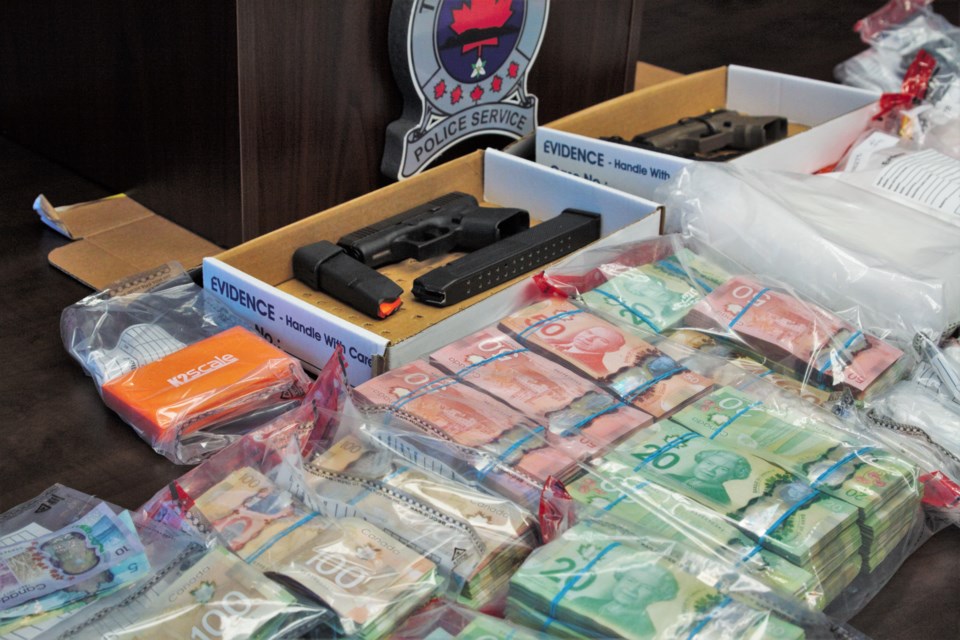 Police report seizing over $100,000 in cash, and drugs including fentanyl, cocaine, and oxycodone with an estimated value of $350,000. (Photos by Ian Kaufman, TBnewswatch)