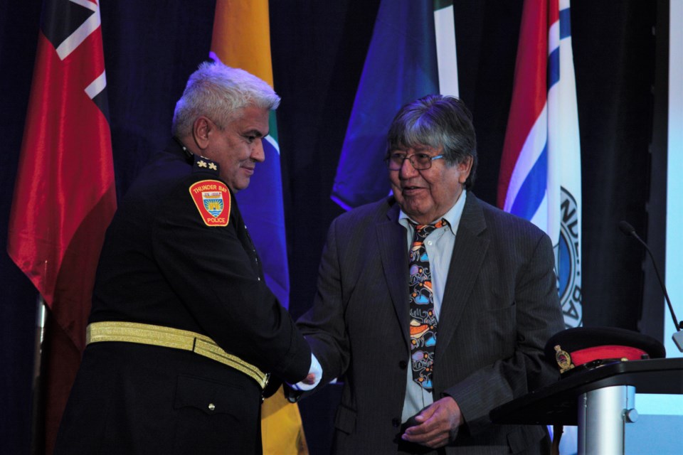 Chief Darcy Fleury, left, accepts a gift from Matawa CEO David Paul Achneepineskum during his swearing-in ceremony on Monday. (Photos by Ian Kaufman, TBnewswatch)