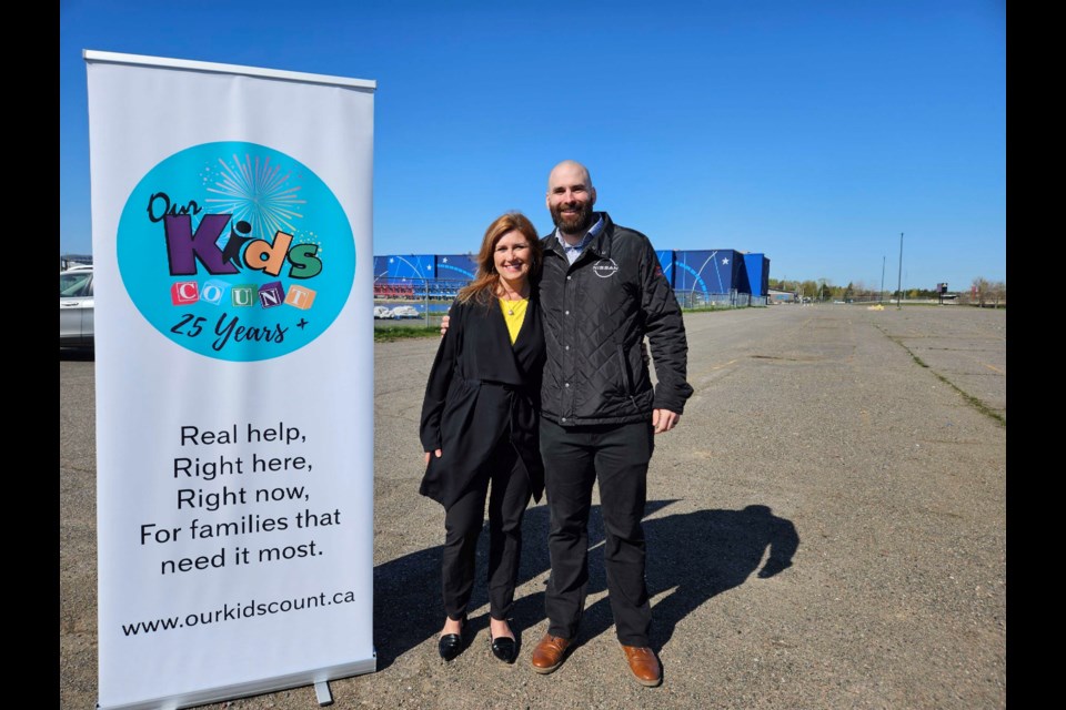 Our Kids Count development manager Emey Hendricks and Half-Way Motors Group representative Daniel Trevisanutto on Thursday announced the dates for this summer's Ribfest.