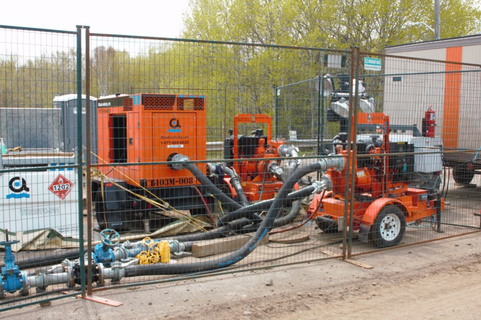 Pumps carry sewage through temporary lines until a new culvert is in place. An inflow briefly exceeded the pumps' capacity on Tuesday, the city said. (Ian Kaufman, TBnewswatch)