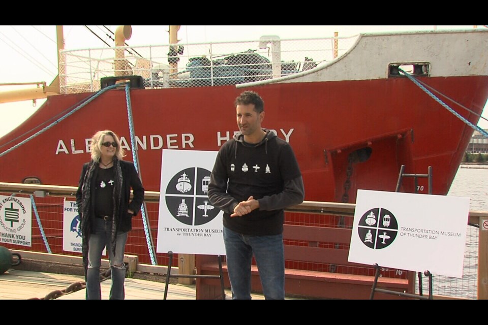 Artist Heather Dickson, left, and Transportation Museum of Thunder Bay spokesperson Anthony Foglia spoke at a news conference on May 17, 2023 at the Pool 6 site on the Thunder Bay waterfront (Vasilios Bellos, TBT News)