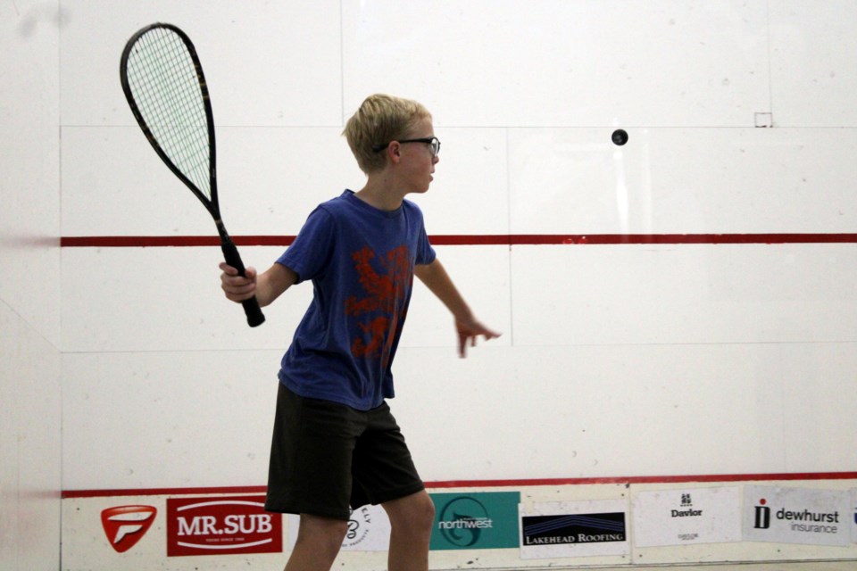 Graham Bill prepares to make a serve during his Junior 'A' division game against Luka Tropea at the Northwestern Ontario Squash Open on Friday evening. 