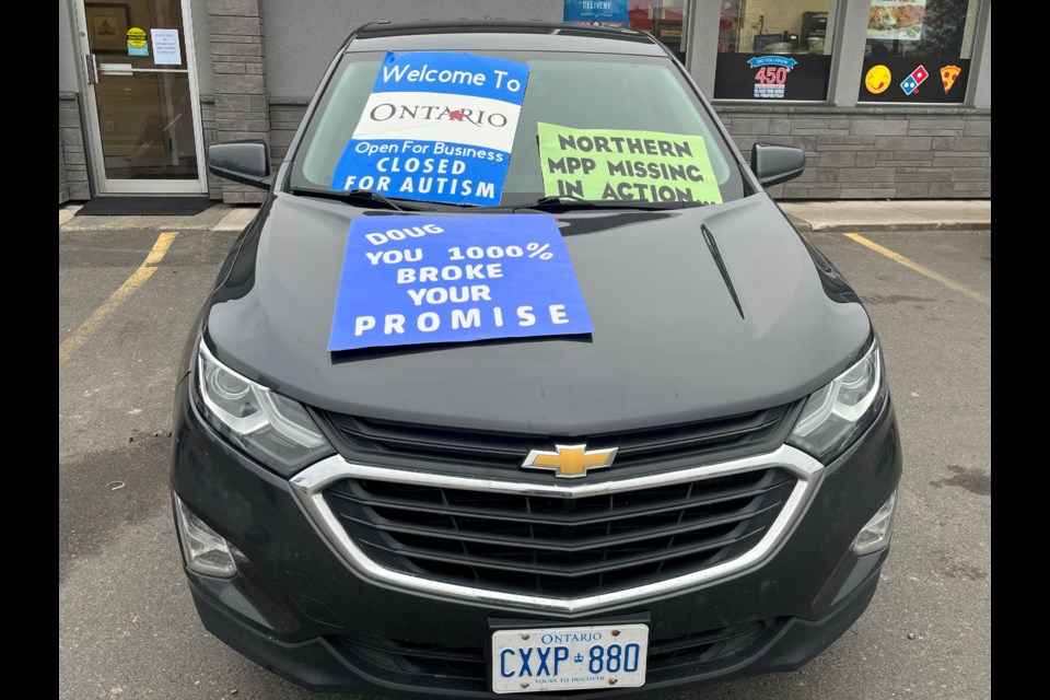 Signage covering the vehicle of Northern Autism Families Matter co-founder Adrianna Atkins on Monday, October 16, 2023