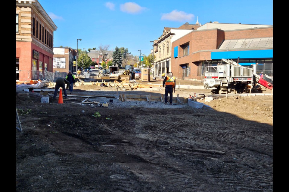 Crews continue their work in the intersection of Red River Road and Court Street.