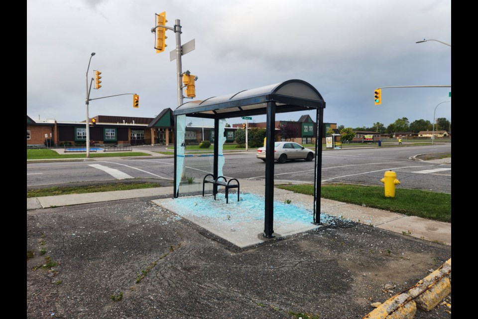 Shattered glass was all that remained of the panels on a bus shelter at River and Madeline Streets (TBnewswatch)