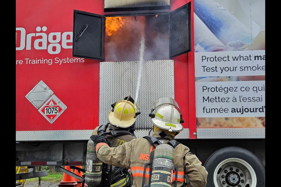 Firefighters showcase one of the mobile training units
