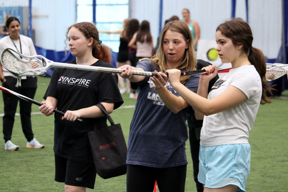 Alyssa Piccolo of Thunder Bay Lacrosse gave tips to Grade 9 students during the INSPIRE - Sport & Health for Life event at Lakehead University on Tuesday.