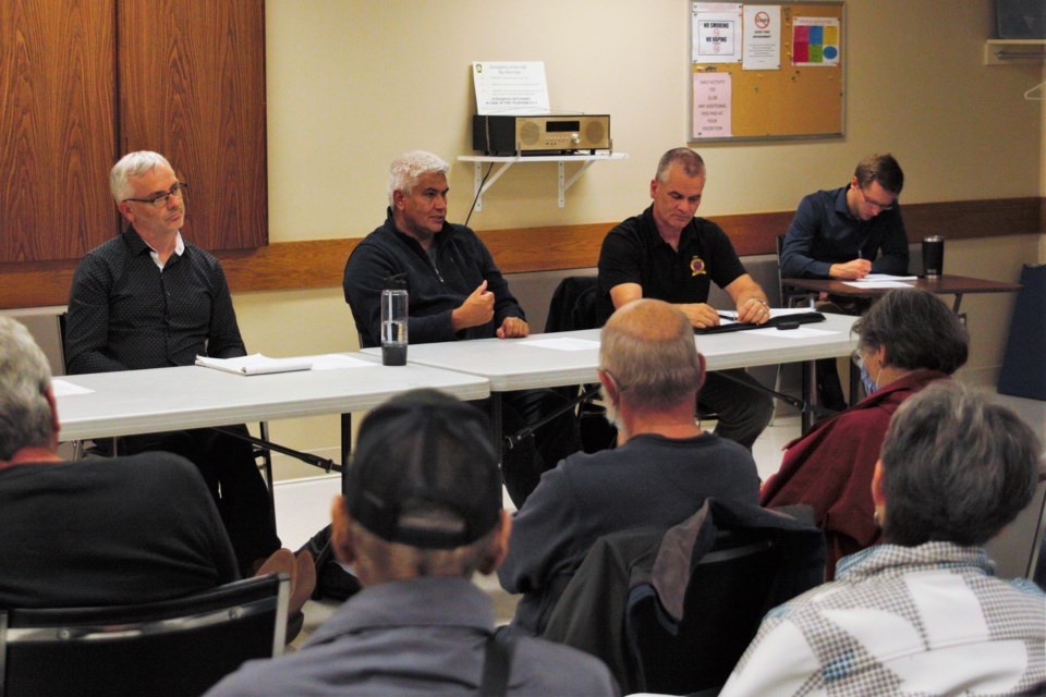 Red River Coun. Michael Zussino, at left, chaired a ward meeting Thursday that touched on issues of crime and vandalism, with police Chief Darcy Fleury and Deputy Chief Ryan Hughes present. (Ian Kaufman, TBnewswatch)