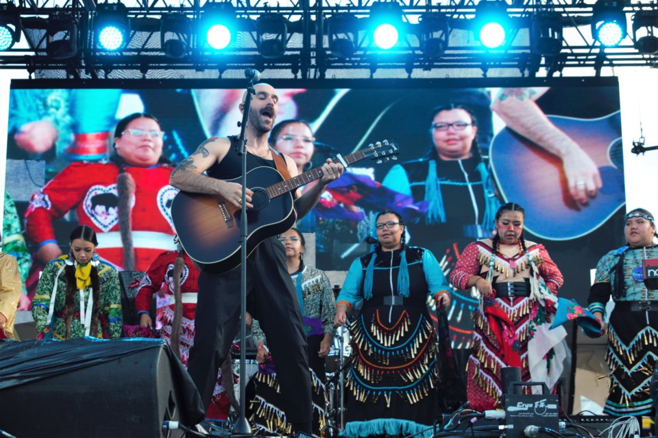 X Ambassadors were joined by a jingle dress dancing group featuring DFC students at the Wake the Giant festival on Saturday. (Ian Kaufman, TBnewswatch)