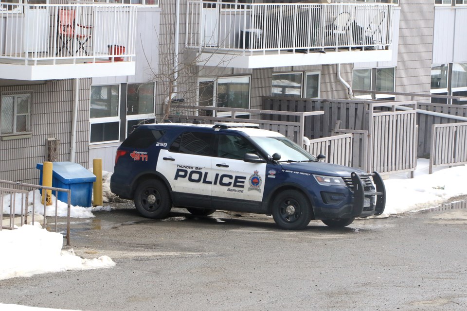 A Thunder Bay Police vehicle sits outside an apartment complex on Academy Drive on Tuesday, April 2, 2024, where a woman was found dead on Wednesday, March 27, 2024. A man has been arrested and charged with second-degree murder. (Leith Dunick, tbnewswatch.com)