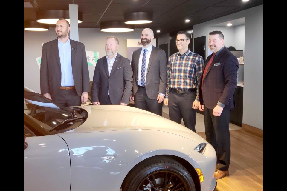 From left, Bryan Leitch, regional manager with Mazda Canada; Chris Harrison, dealer business manager with Mazda; Daniel Trevisanutto, partner with Half-Way Motors Group; Patrick Trevisanutto, managing partner with Half-Way Motors Group and dealer principal with Mazda; and Alan Perales, the dealership's general manager, celebrated the opening of the new location on Thursday.