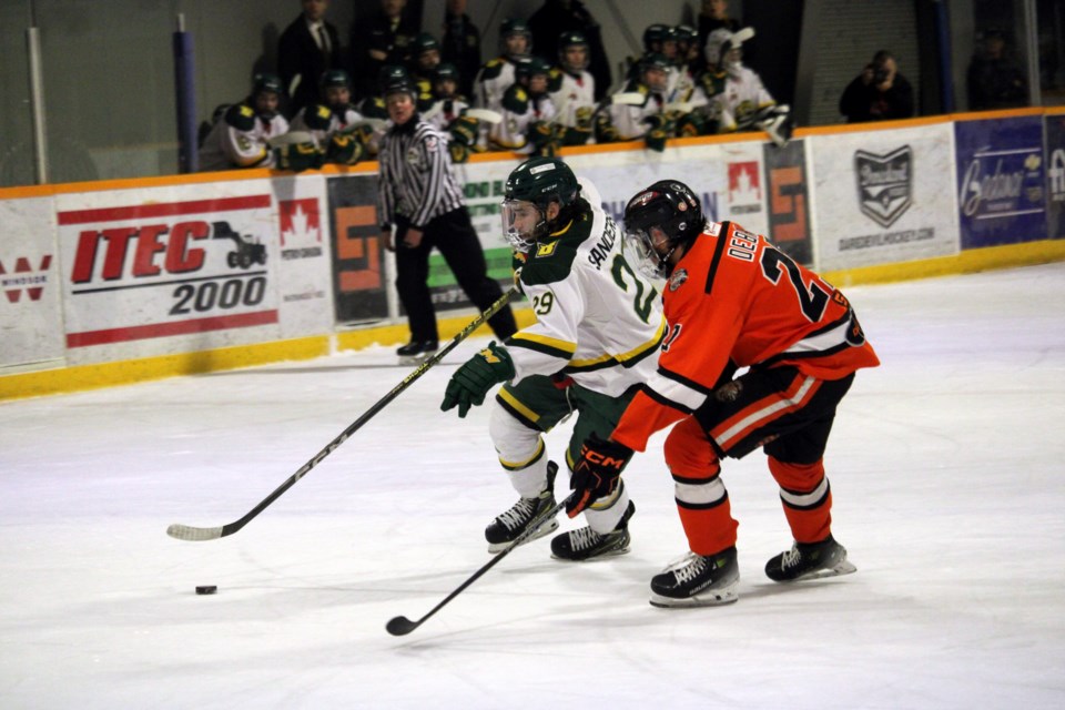 Sioux Lookout Bombers forward Trever Sanderson works his way around Kam River Fighting Walleye defenceman Easton Debray during Game 1 of the Superior International Junior Hockey League final at the Norwest Arena on Wednesday night.