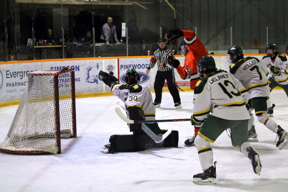 Sioux Lookout Bombers goaltender Jack Osmond snags the puck out of the air after Kam River Fighting Walleye forward Riley Borody redirected a shot during Game 2 of the Superior International Junior Hockey League final on Thursday at the Norwest Arena.