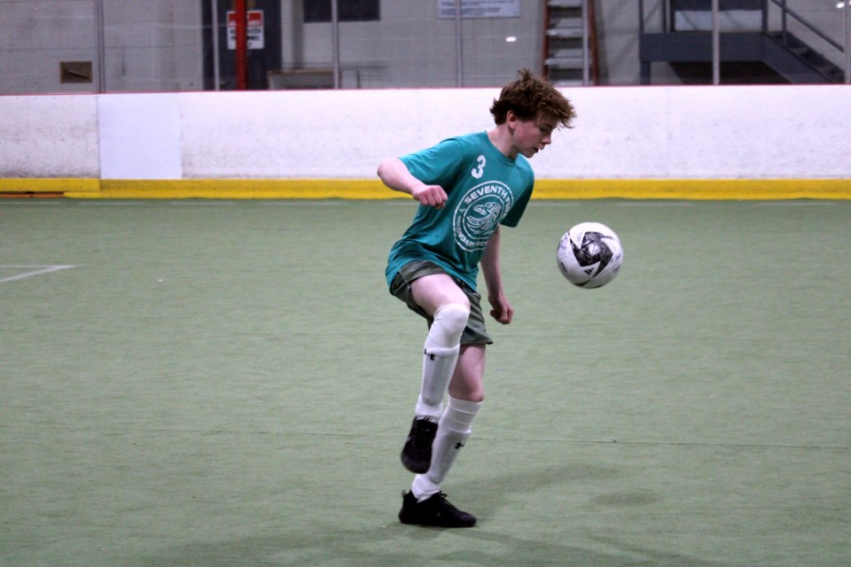 Colin Woods controls the ball for the Seventh Fire Eagles during a junior boys match against the St. Patrick Saints at the Thunder Bay Tournament Centre Monday.
