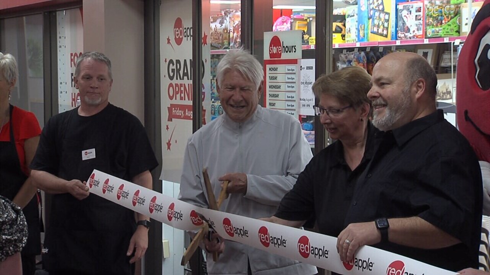 red-apple-ribbon-cut